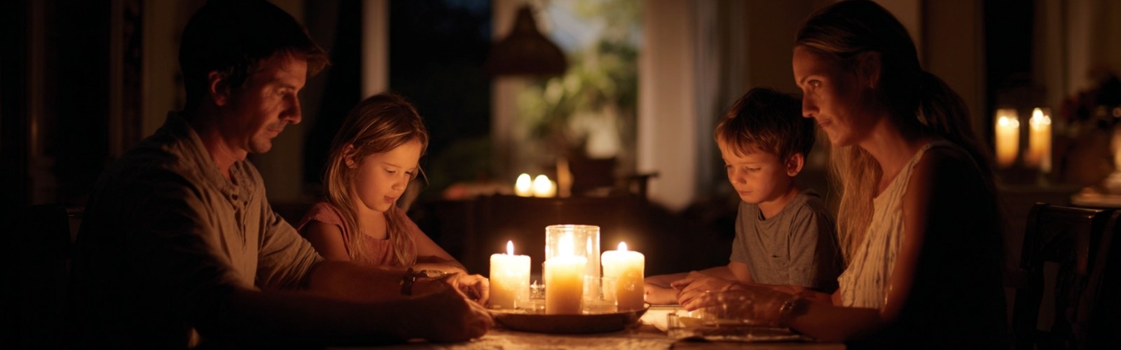 Florida family gathered by candlelight during hurricane power outage